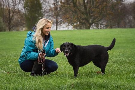 Four Legged Friends Petcare - Kelly with happy dog.jpg