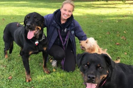 Four Legged Friends Petcare - Kelly with happy rottweilers.jpg